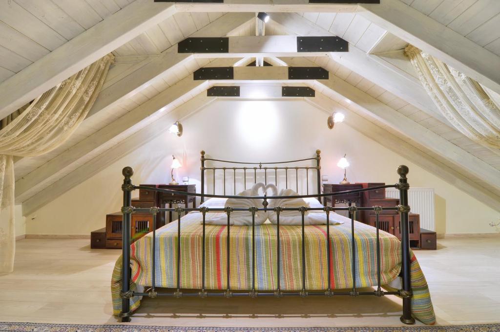 Postel nebo postele na pokoji v ubytování Melinas Boutique Hotel B&B