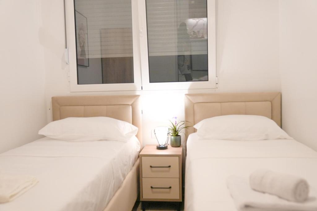 Postel nebo postele na pokoji v ubytování Mar nero Apartments