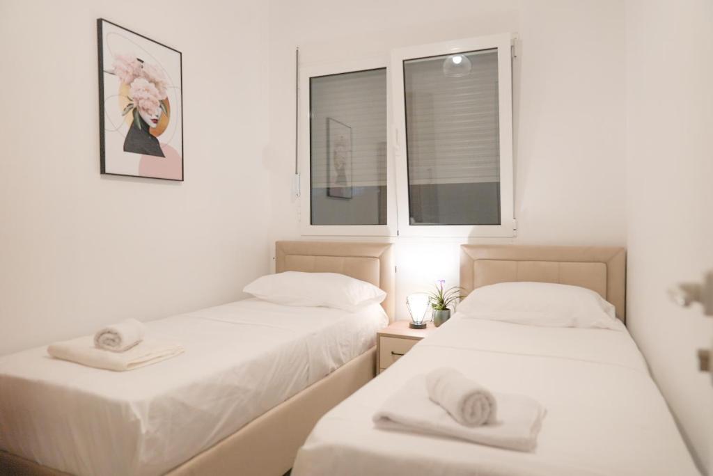 Postel nebo postele na pokoji v ubytování Mar nero Apartments