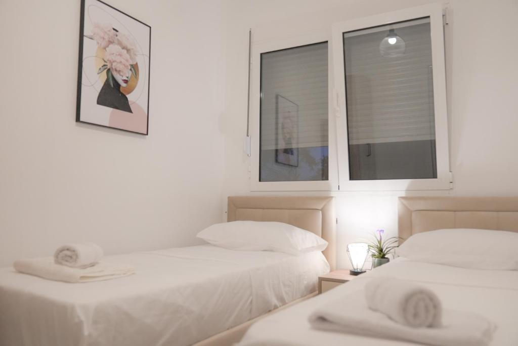 Postel nebo postele na pokoji v ubytování Mar nero Apartments