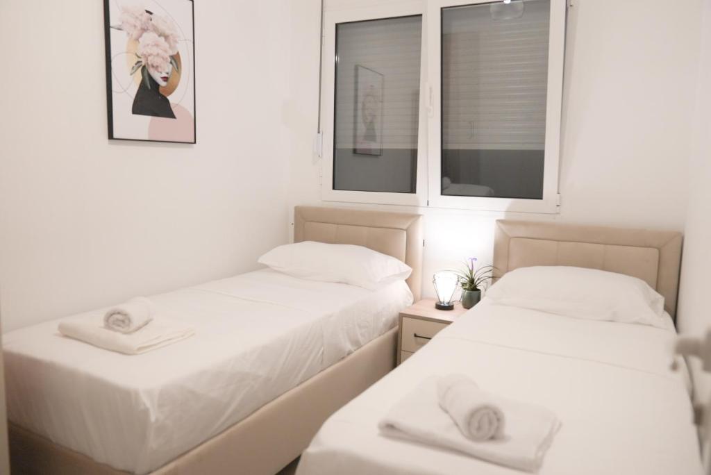 Postel nebo postele na pokoji v ubytování Mar nero Apartments