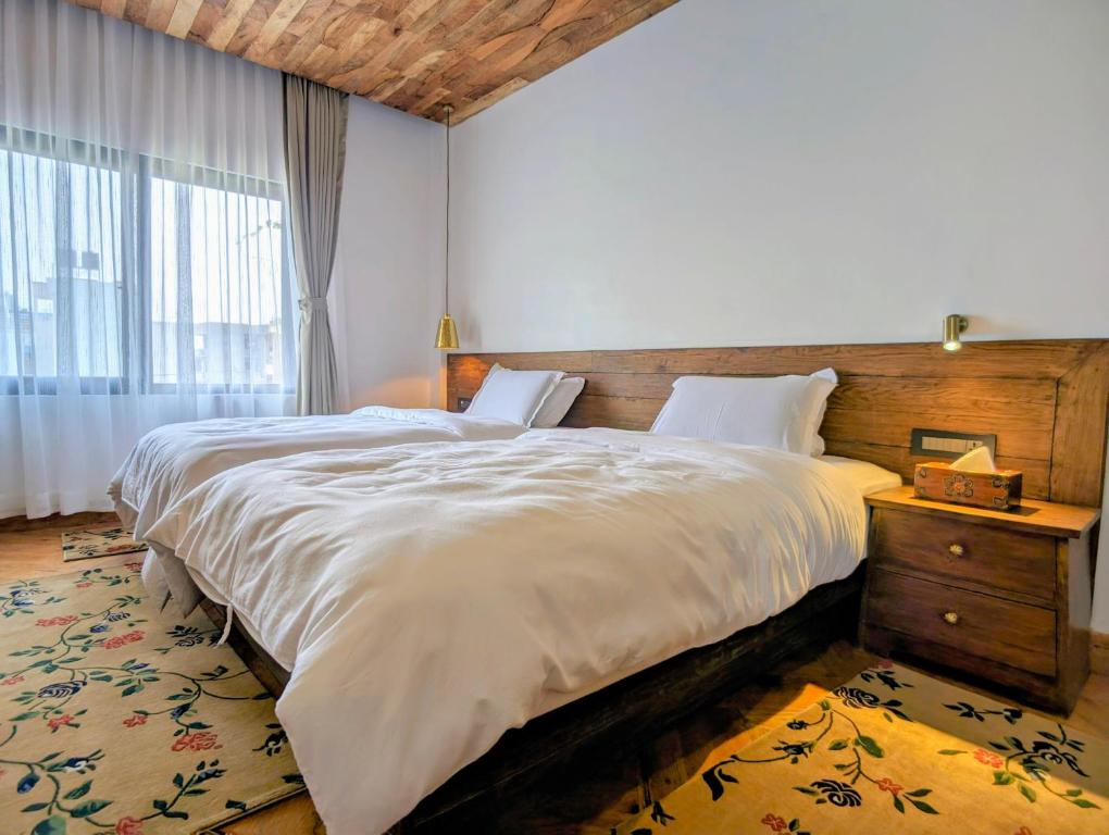Postel nebo postele na pokoji v ubytování Uma Residence and Suites