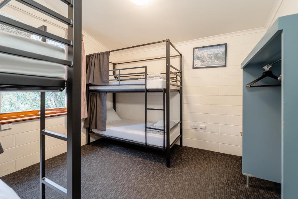 a bunk room with bunk beds in it at YHA Thredbo in Thredbo