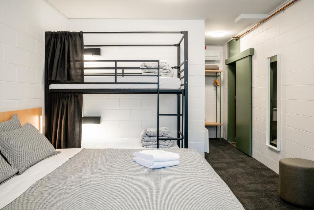 a room with two bunk beds in it at YHA Thredbo in Thredbo