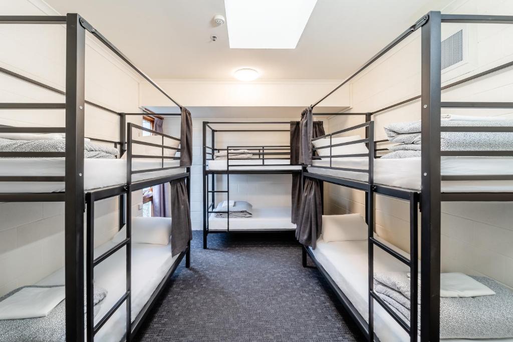 a group of bunk beds in a dorm room at YHA Thredbo in Thredbo