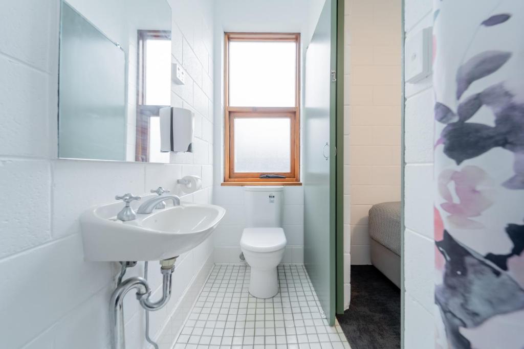 a bathroom with a sink and a toilet at YHA Thredbo in Thredbo