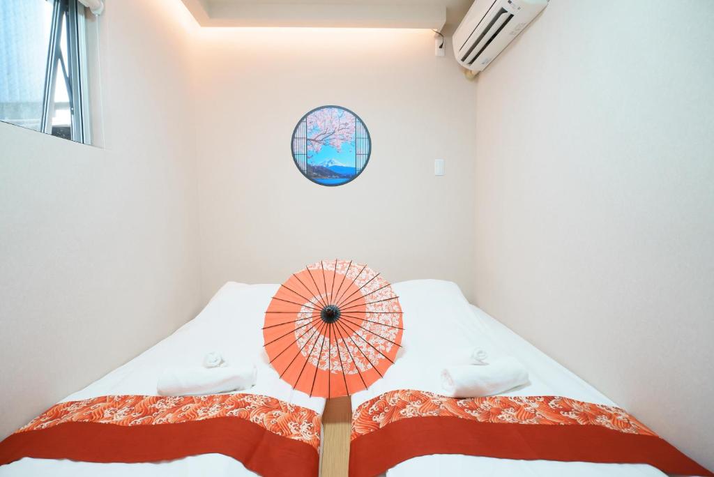 Postel nebo postele na pokoji v ubytování OHAYO Hotel 大森西