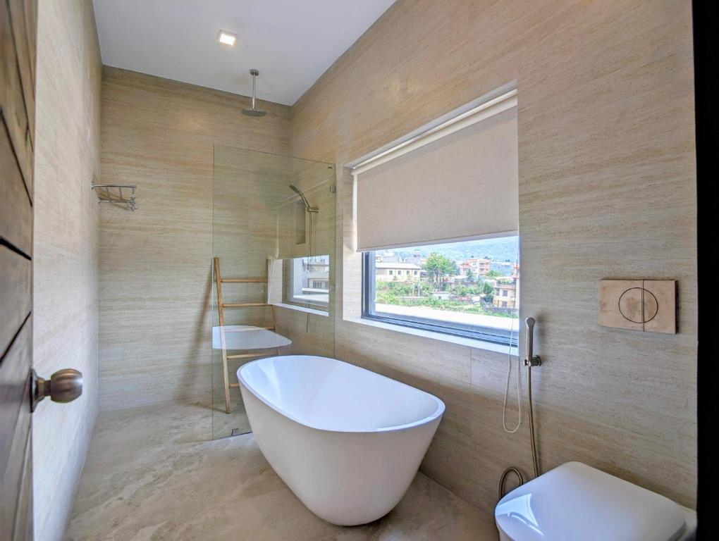 Koupelna v ubytování Uma Residence and Suites
