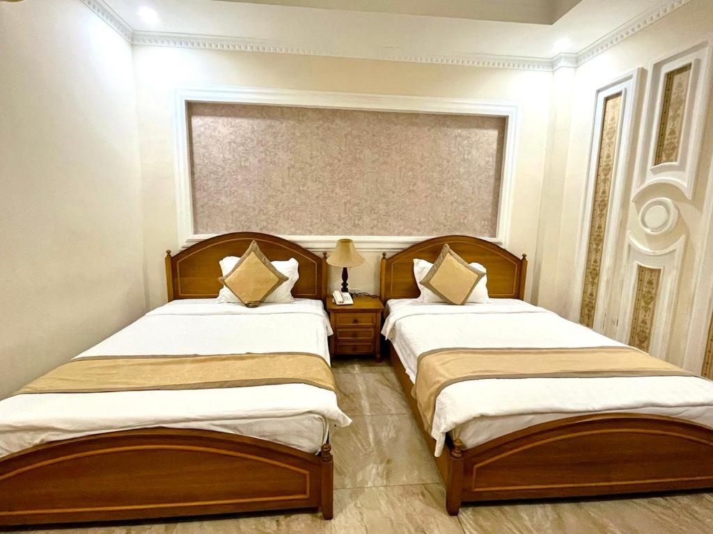 Postel nebo postele na pokoji v ubytování Madella Hotel