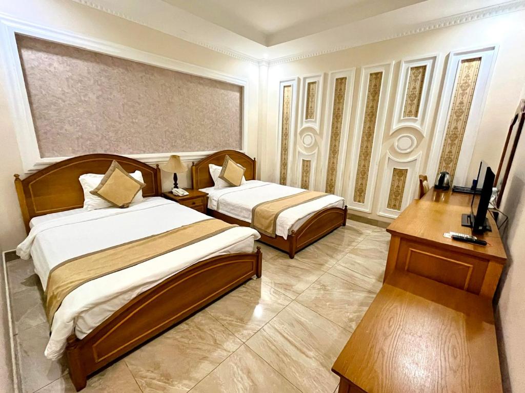Postel nebo postele na pokoji v ubytování Madella Hotel