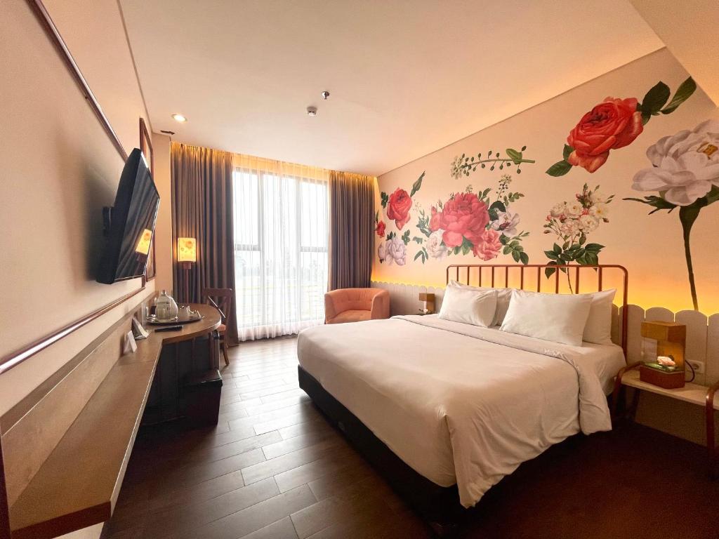 Postel nebo postele na pokoji v ubytování Hemangini Hotel Bandung