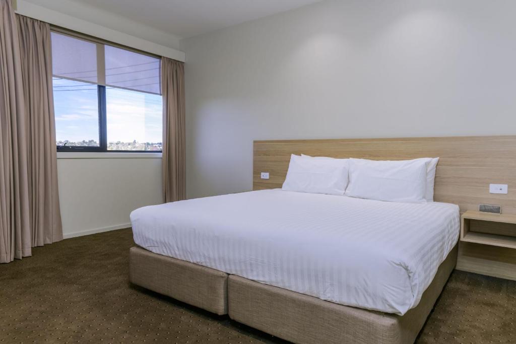 Postel nebo postele na pokoji v ubytování Elimatta Hotel