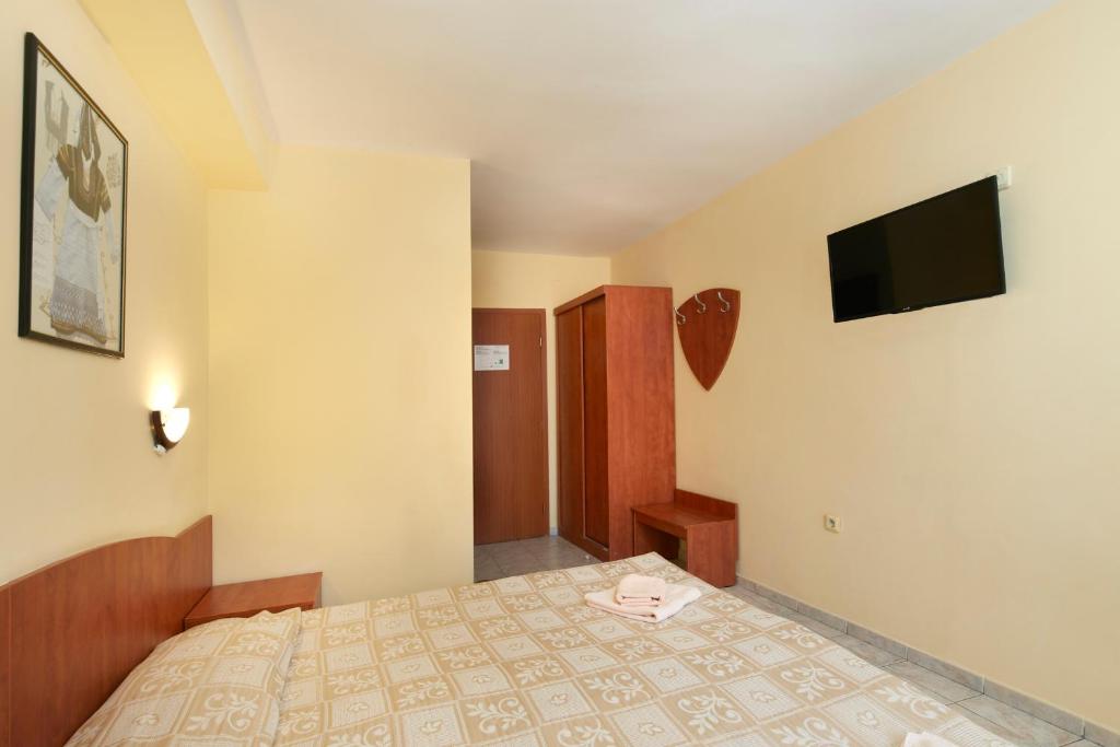 Postel nebo postele na pokoji v ubytování Family Hotel Andreev