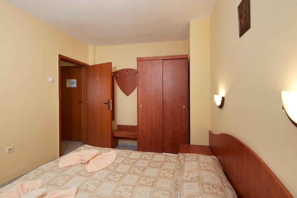 Postel nebo postele na pokoji v ubytování Family Hotel Andreev