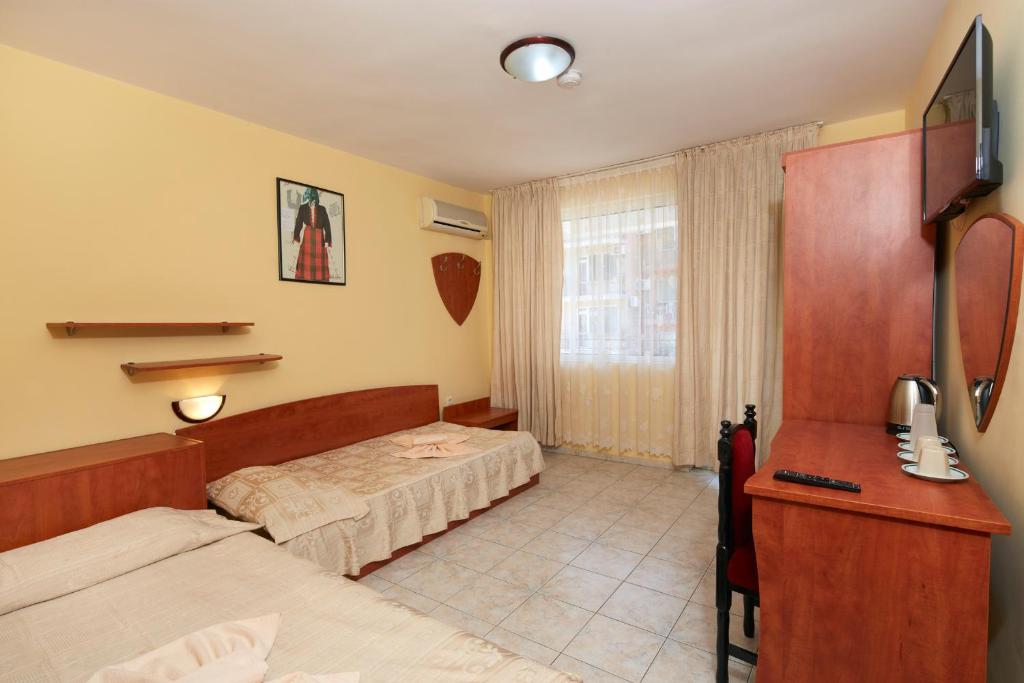 Postel nebo postele na pokoji v ubytování Family Hotel Andreev