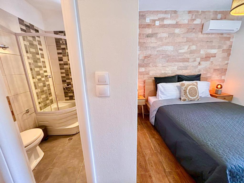Postel nebo postele na pokoji v ubytování Elios Serenity House