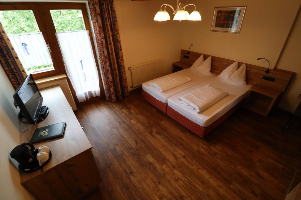 Postel nebo postele na pokoji v ubytování Ferienhotel Fuchs