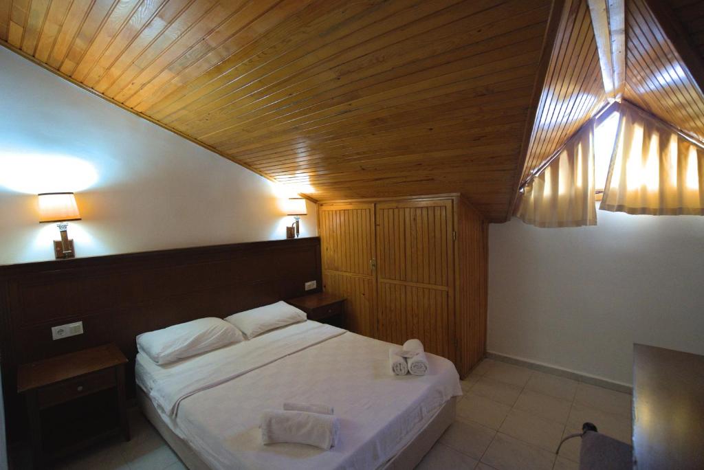 Postel nebo postele na pokoji v ubytování NATURELLA APART HOTEL