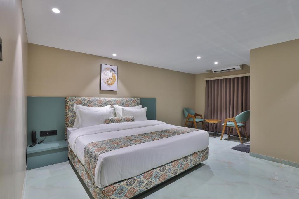 Postel nebo postele na pokoji v ubytování Hotel Serenity