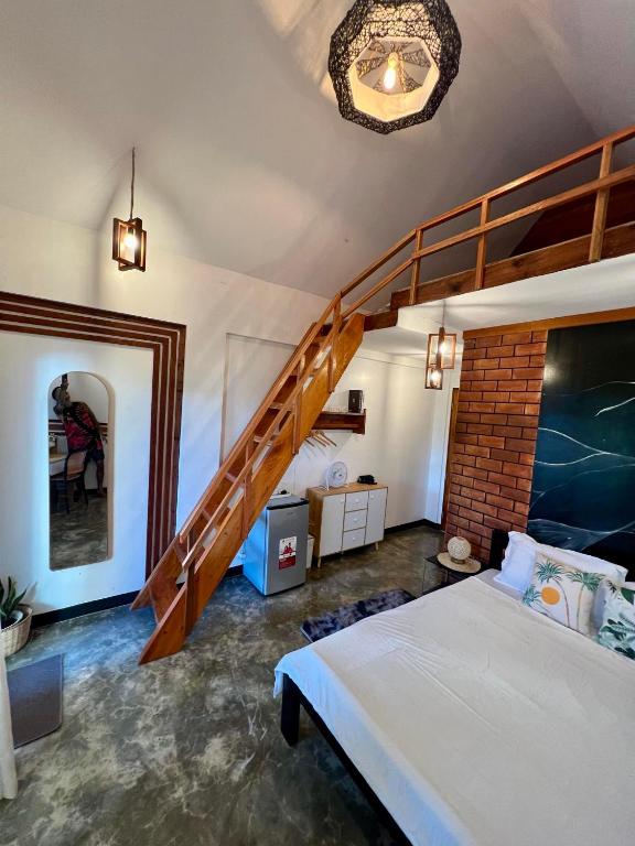 Postel nebo postele na pokoji v ubytování Hakuna Villas
