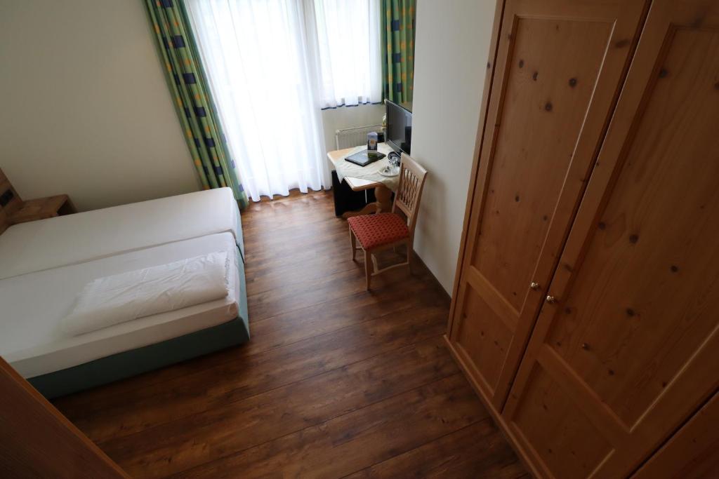 Postel nebo postele na pokoji v ubytování Ferienhotel Fuchs