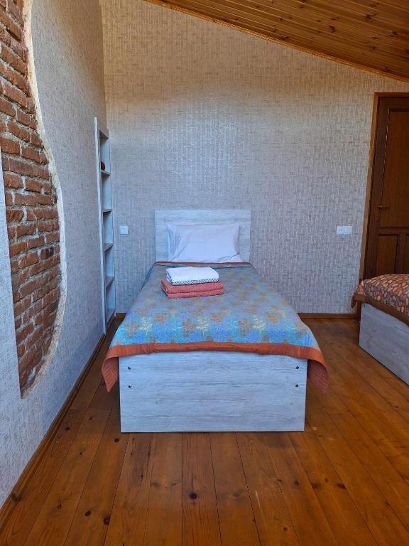 Voodi või voodid majutusasutuse Guesthouse Litoros toas