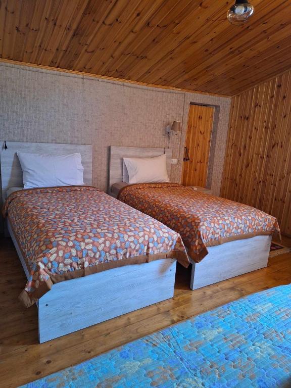 Voodi või voodid majutusasutuse Guesthouse Litoros toas