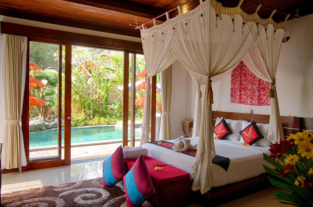 A bed or beds in a room at Baruna Sari Villa and Yoga Retreat