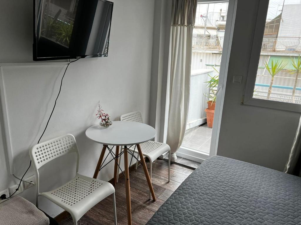 A television and/or entertainment centre at Myron Apartments