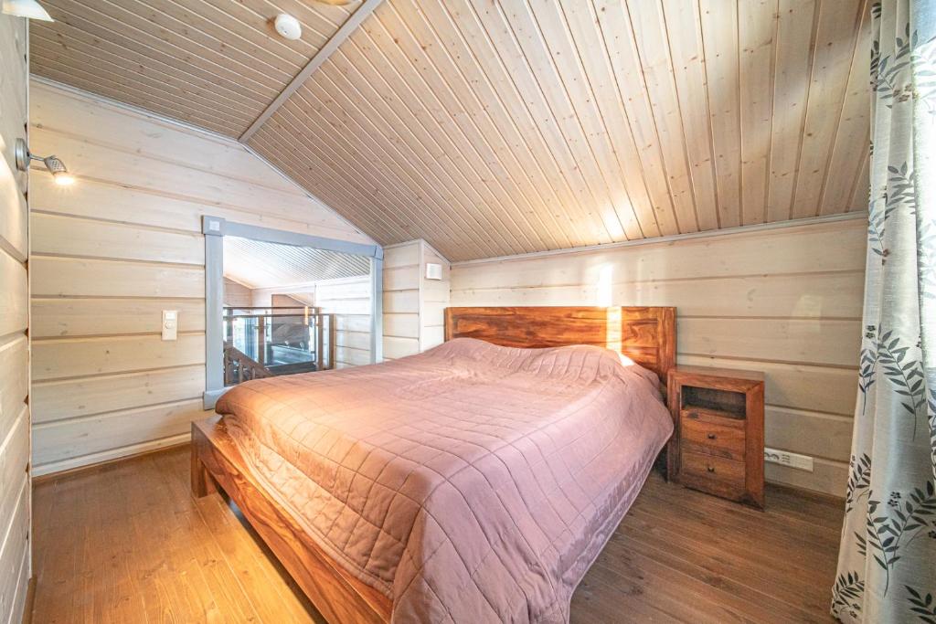 Кровать или кровати в номере Levillas Kinnastie 33 Villas