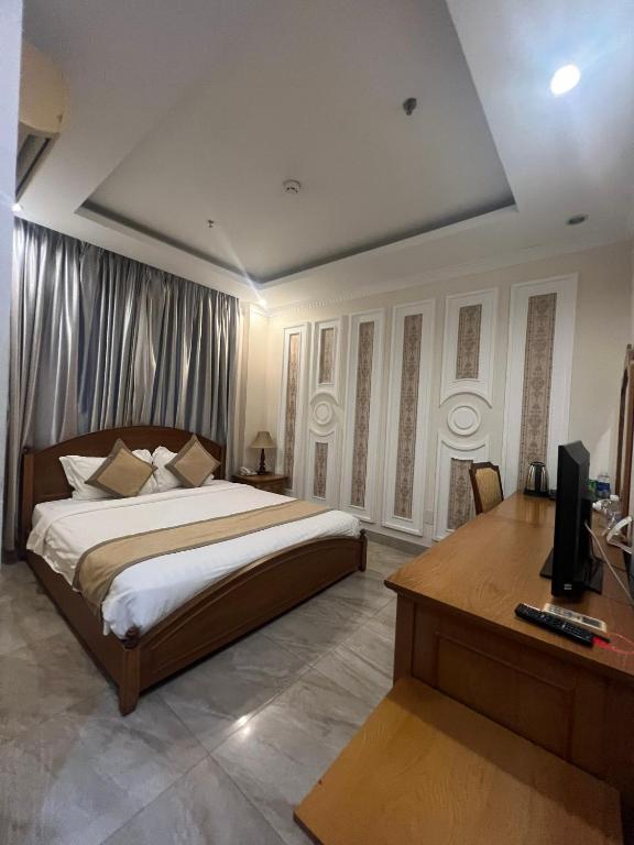 Postel nebo postele na pokoji v ubytování Madella Hotel
