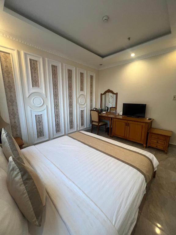 Postel nebo postele na pokoji v ubytování Madella Hotel
