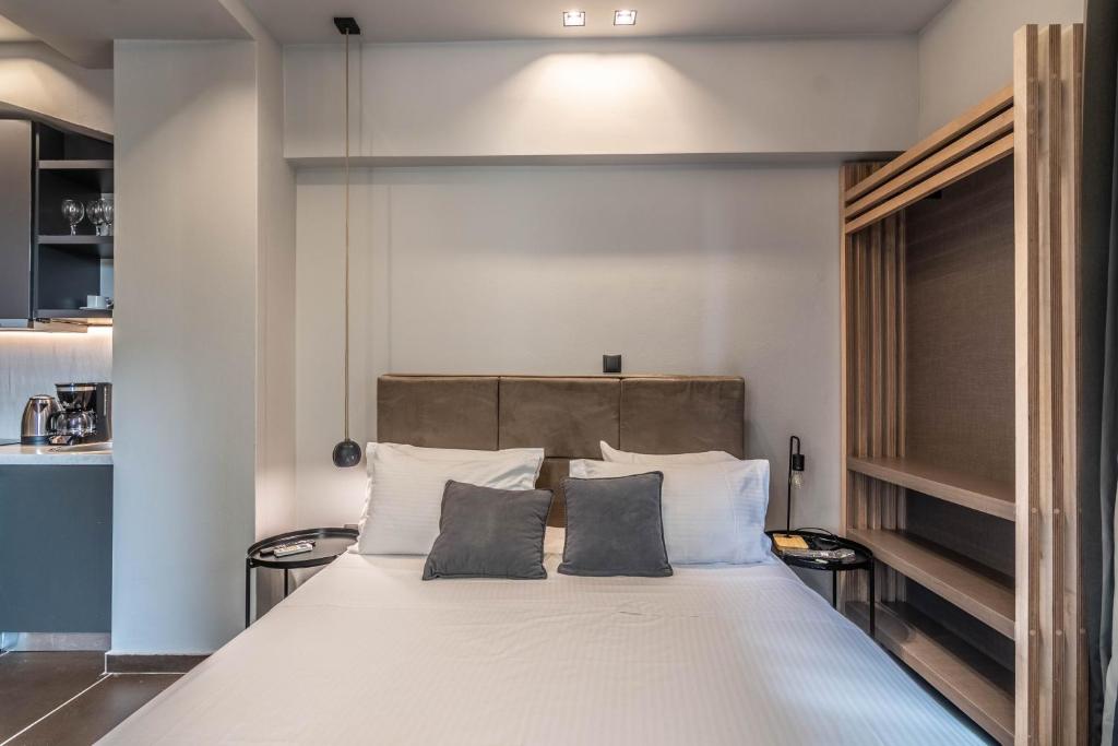 Postel nebo postele na pokoji v ubytování Furla Apartments Athens