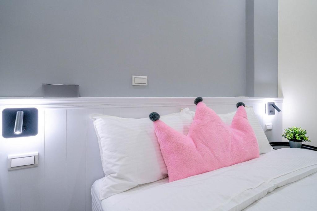 Ένα ή περισσότερα κρεβάτια σε δωμάτιο στο Little House Homestay