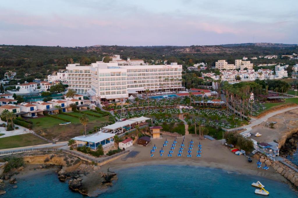 an aerial view of a resort and a beach at Cavo Maris Beach Hotel in Protaras