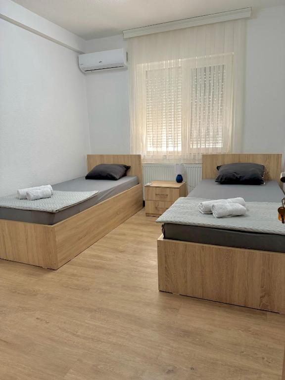 Postel nebo postele na pokoji v ubytování Rooms LikeHome