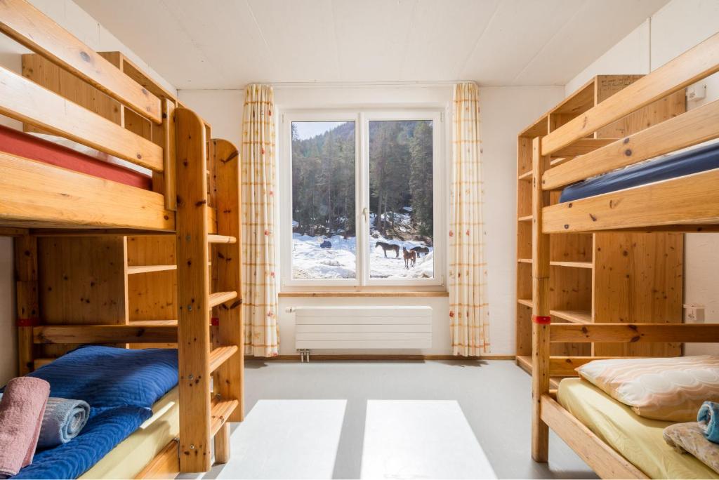 Postel nebo postele na pokoji v ubytování Reitstall und Saloon San Jon