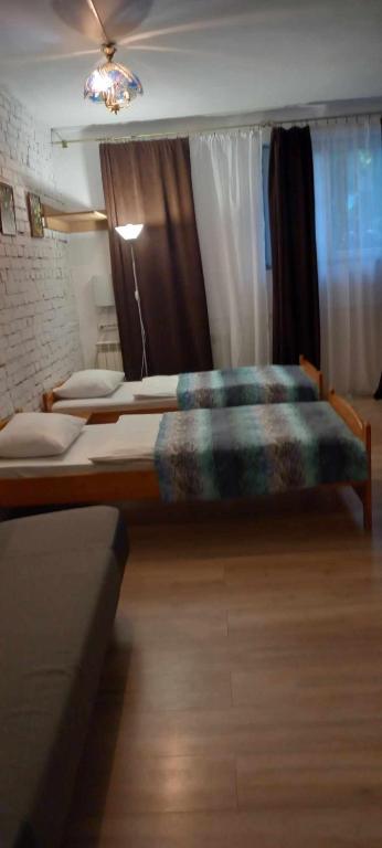 Postel nebo postele na pokoji v ubytování AUGUST Ośrodek Wypoczynkowy