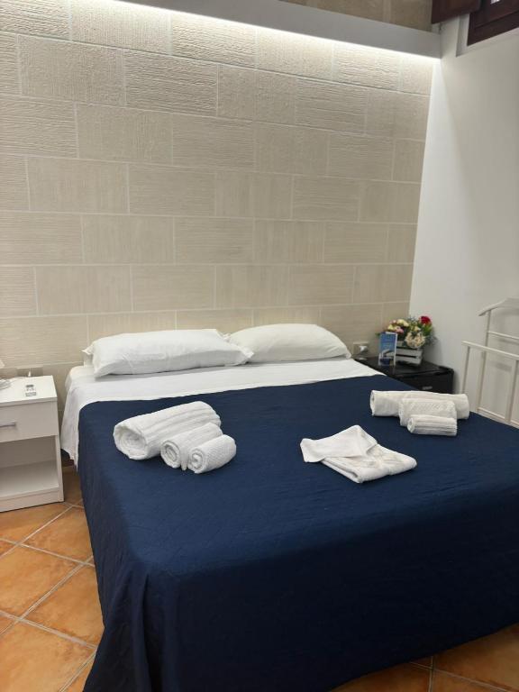 Postel nebo postele na pokoji v ubytování "L'Oasi di Favignana" Room and Charme