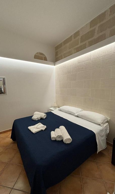Postel nebo postele na pokoji v ubytování "L'Oasi di Favignana" Room and Charme