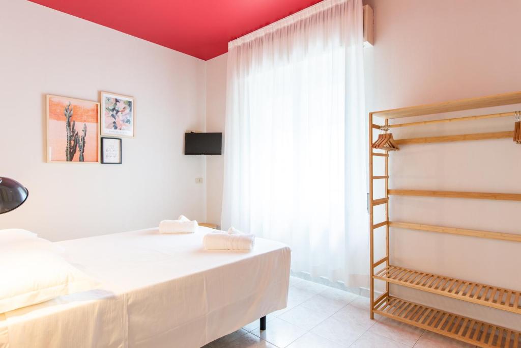 Postel nebo postele na pokoji v ubytování Hotel Belvedere Rimini