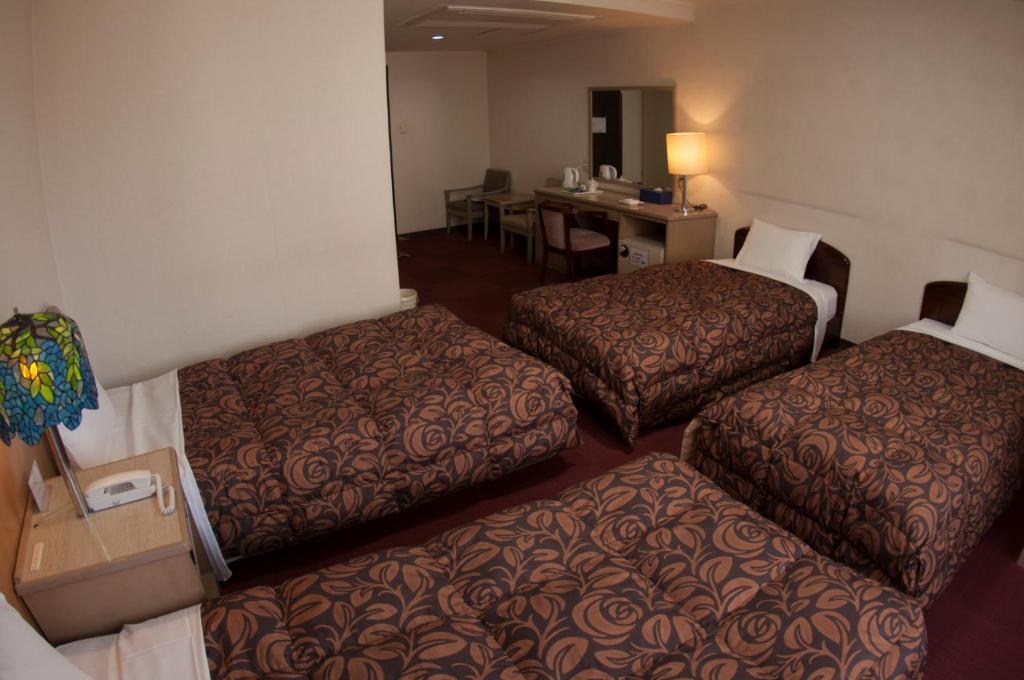 Postel nebo postele na pokoji v ubytování Hotel Luna Park