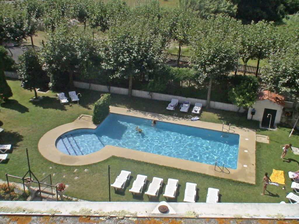 The swimming pool at or close to Apartamentos Revo Salinas 3000