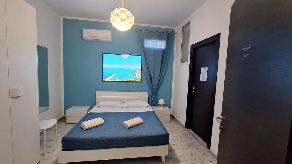 Postel nebo postele na pokoji v ubytování B&B A Mare