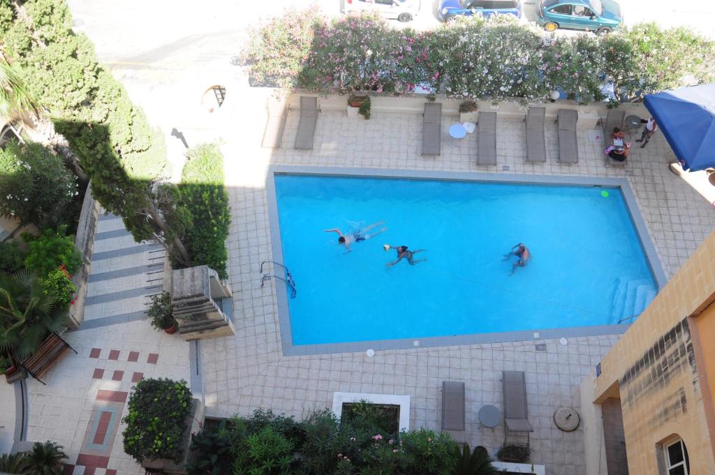 Bazén v ubytování Il Palazzin Hotel nebo v jeho okolí