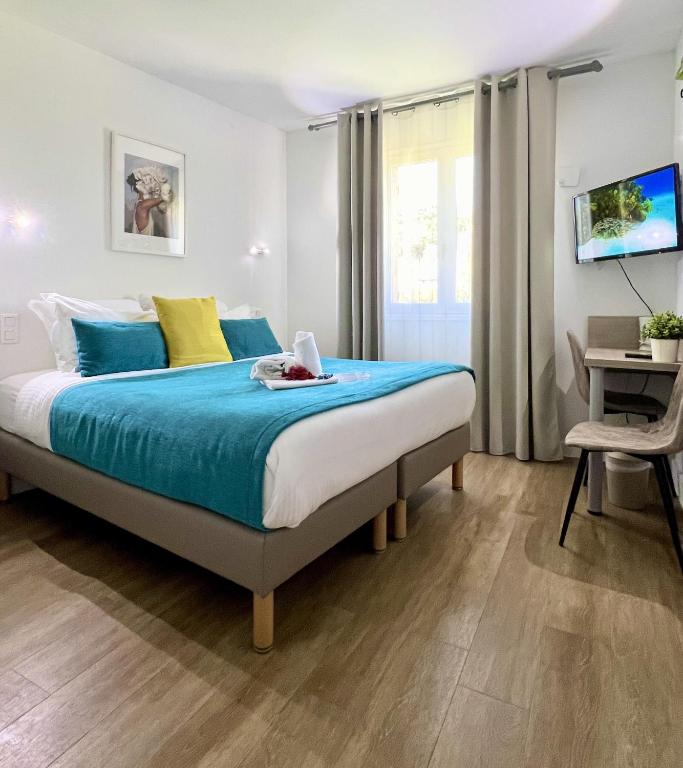 Postel nebo postele na pokoji v ubytování Hotel L'Escapade