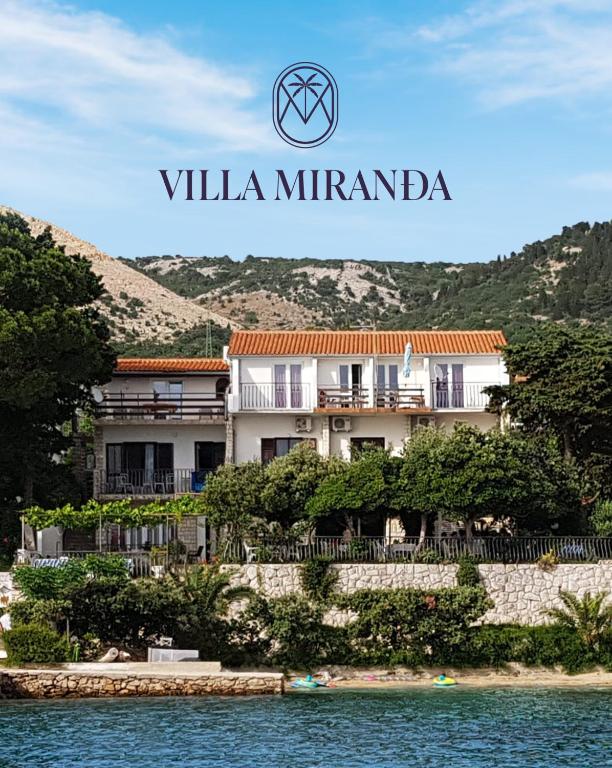 a villa miranda in the middle of the water at Apartments Vila Miranda 2 in Barbat na Rabu