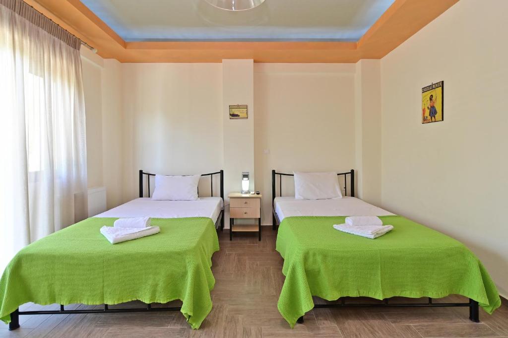 Postel nebo postele na pokoji v ubytování Villa Galini Paliouri