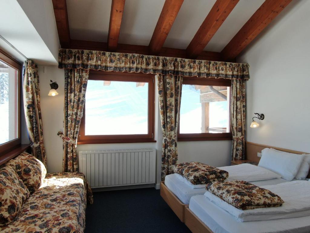 Postel nebo postele na pokoji v ubytování Hotel Fortini