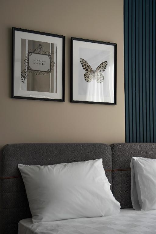 Postel nebo postele na pokoji v ubytování Doqu Suites Hotel